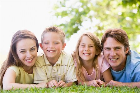 simsearch:400-04043055,k - Family lying outdoors smiling Stock Photo - Budget Royalty-Free & Subscription, Code: 400-04042815