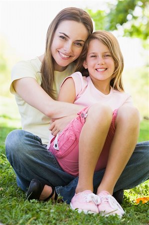 simsearch:400-04043055,k - Woman and young girl outdoors embracing and smiling Stock Photo - Budget Royalty-Free & Subscription, Code: 400-04042812