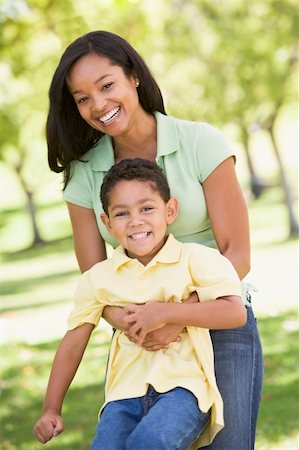 simsearch:400-04042848,k - Woman and young boy outdoors embracing and smiling Foto de stock - Super Valor sin royalties y Suscripción, Código: 400-04042839