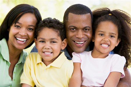 simsearch:400-04043055,k - Family outdoors smiling Stock Photo - Budget Royalty-Free & Subscription, Code: 400-04042849