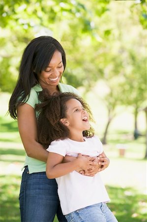 simsearch:400-04043055,k - Woman and young girl outdoors embracing and smiling Stock Photo - Budget Royalty-Free & Subscription, Code: 400-04042840