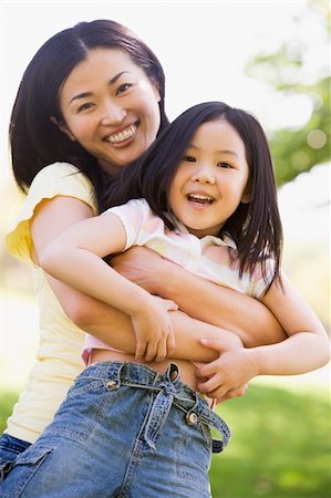 simsearch:400-04043055,k - Woman and young girl outdoors embracing and smiling Stock Photo - Budget Royalty-Free & Subscription, Code: 400-04042856
