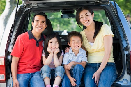 sitting on the tailgate - Family sitting in back of van smiling Stock Photo - Budget Royalty-Free & Subscription, Code: 400-04042869