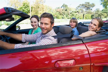 Family in convertible car smiling Stock Photo - Budget Royalty-Free & Subscription, Code: 400-04042887