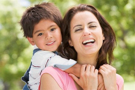 simsearch:400-04043055,k - Woman and young boy outdoors embracing and smiling Stock Photo - Budget Royalty-Free & Subscription, Code: 400-04043048