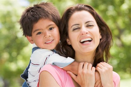 simsearch:400-04042848,k - Woman and young boy outdoors embracing and smiling Foto de stock - Super Valor sin royalties y Suscripción, Código: 400-04043048