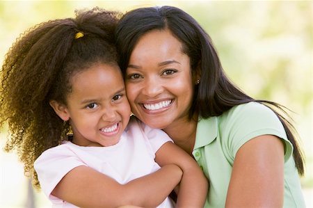 simsearch:400-04046012,k - Woman and young girl outdoors embracing and smiling Stockbilder - Microstock & Abonnement, Bildnummer: 400-04043055