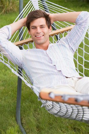 pictures of men sleeping in hammocks - Man relaxing in hammock smiling Stock Photo - Budget Royalty-Free & Subscription, Code: 400-04043137