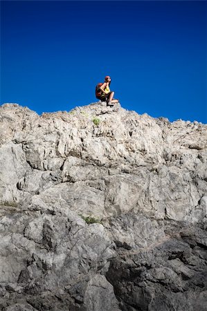 simsearch:400-07176526,k - young woman resting on top of the mountain after hiking Stock Photo - Budget Royalty-Free & Subscription, Code: 400-04043241
