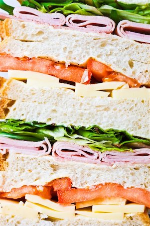 simsearch:400-04054021,k - Thick fresh sandwich with tomato, cheese, ham and lettuce Photographie de stock - Aubaine LD & Abonnement, Code: 400-04054670