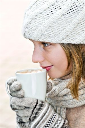 drinking hot chocolate with mittens - Teenage girl in winter hat with cup of hot chocolate Stock Photo - Budget Royalty-Free & Subscription, Code: 400-04054901
