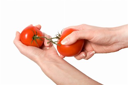 hands breaking fasten tomato isolated on white background Stock Photo - Budget Royalty-Free & Subscription, Code: 400-04055747