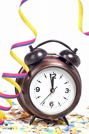 simsearch:400-05082002,k - Waiting the New Year with clock, confetti and ribbons. Shallow depth of field Photographie de stock - Aubaine LD & Abonnement, Code: 400-04055968