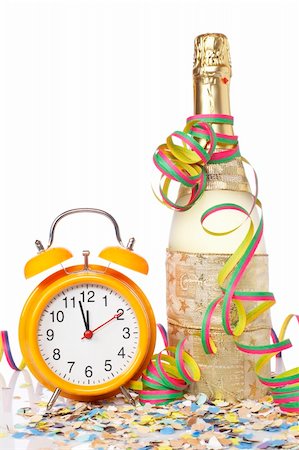 pic of drinking celebration for new year - Waiting the New Year with champagne bottle and clock. Shallow depth of field Stock Photo - Budget Royalty-Free & Subscription, Code: 400-04056288