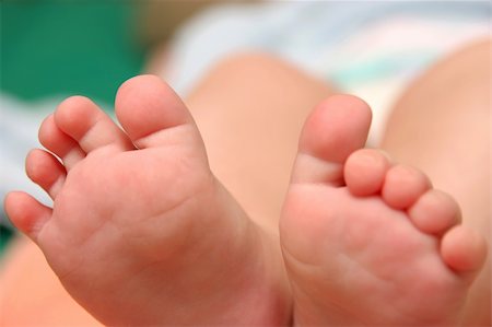 Baby feet in closeup Stock Photo - Budget Royalty-Free & Subscription, Code: 400-04057190