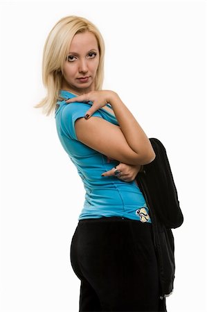 simsearch:400-04502103,k - Beautiful blond hair woman wearing blue shirt and black pants looking over should while standing over white Stock Photo - Budget Royalty-Free & Subscription, Code: 400-04057273