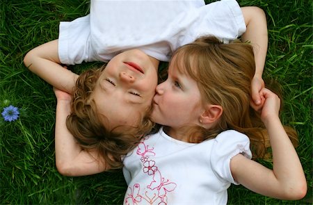 A set of boy/girl twins playing in the grass Stock Photo - Budget Royalty-Free & Subscription, Code: 400-04057453