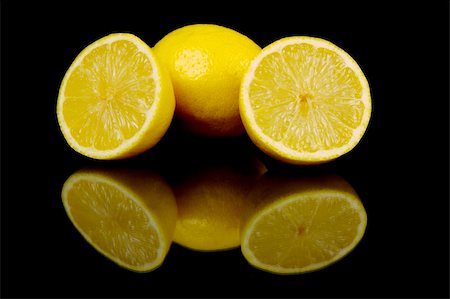 Lemon and lime citrus fruit isolated against a black background Stock Photo - Budget Royalty-Free & Subscription, Code: 400-04057509