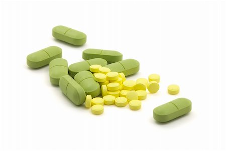 simsearch:400-06852415,k - Green and yellow pills with dose on white background Fotografie stock - Microstock e Abbonamento, Codice: 400-04057564