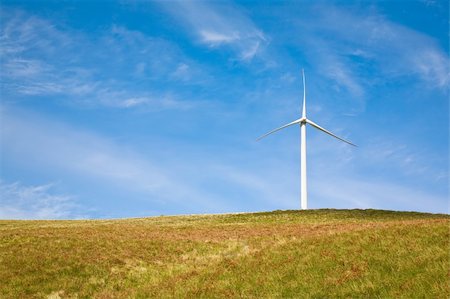 simsearch:400-04465410,k - Wind tower on a field with blue sky. Stock Photo - Budget Royalty-Free & Subscription, Code: 400-04057584