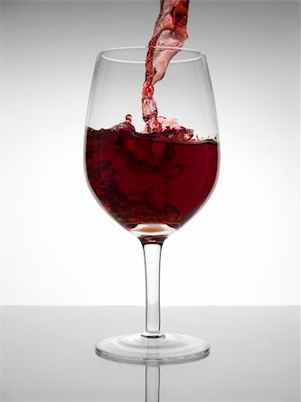 simsearch:400-04935153,k - A malbec glass pooring with red wine Photographie de stock - Aubaine LD & Abonnement, Code: 400-04057750