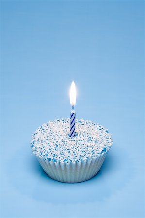 selectphoto (artist) - A blue cupcake with white sprinkles and a candle Stock Photo - Budget Royalty-Free & Subscription, Code: 400-04057781