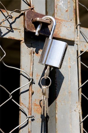 A heavy lock on a wire gate - open padlock with keys Stock Photo - Budget Royalty-Free & Subscription, Code: 400-04057838