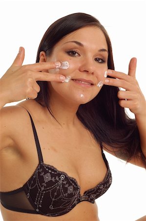 simsearch:400-04127590,k - attractive brunette woman applying cream Stock Photo - Budget Royalty-Free & Subscription, Code: 400-04058713