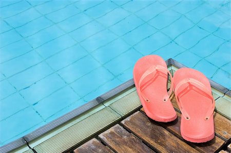 swim accessories - Red Flip Flops by the pool. Stock Photo - Budget Royalty-Free & Subscription, Code: 400-04058759