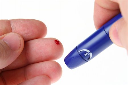 diabetes care - Diabetic is doing a glucose level finger blood test Stock Photo - Budget Royalty-Free & Subscription, Code: 400-04059119