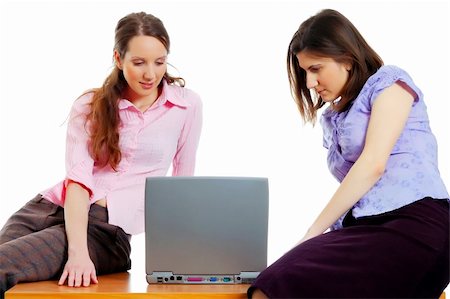 two young attractive women working with the computer Stock Photo - Budget Royalty-Free & Subscription, Code: 400-04059794