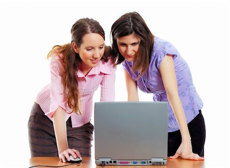 two young attractive women working with the computer Stock Photo - Budget Royalty-Free & Subscription, Code: 400-04059793