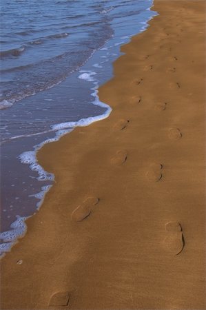 sole feet beach - footprints left in the sand of an irish beach with the tide coming in Stock Photo - Budget Royalty-Free & Subscription, Code: 400-04059835