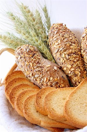 Assortment of baked bread with wheat isolated on white background Stock Photo - Budget Royalty-Free & Subscription, Code: 400-04059924