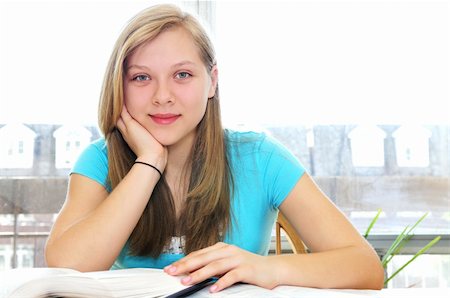 simsearch:400-04059956,k - Happy smiling teenage girl studying with textbooks Stock Photo - Budget Royalty-Free & Subscription, Code: 400-04059958