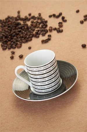 simsearch:400-05005441,k - Cup of cappuccino with cinnamon and spilled out coffee beans. Stock Photo - Budget Royalty-Free & Subscription, Code: 400-04050118