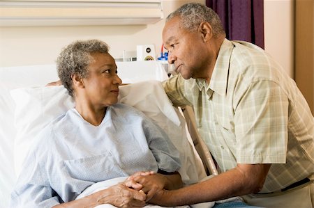 Senior Couple Standing In Hospital Together Stock Photo - Budget Royalty-Free & Subscription, Code: 400-04050950