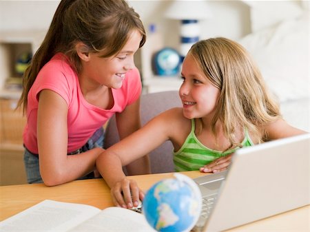 Two Young Girls Doing Homework On A Laptop Stock Photo - Budget Royalty-Free & Subscription, Code: 400-04051693