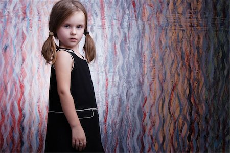 simsearch:400-04140663,k - Cute little fashion model in black dress. Photographie de stock - Aubaine LD & Abonnement, Code: 400-04051893