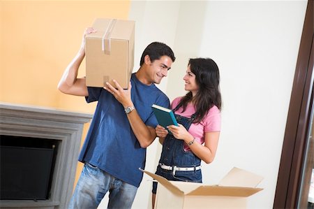 simsearch:614-03648212,k - Young happy couple moving boxes at home Stock Photo - Budget Royalty-Free & Subscription, Code: 400-04052000