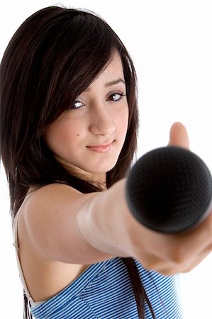 front view of girl showing microphone on  an isolated white background Stock Photo - Budget Royalty-Free & Subscription, Code: 400-04052173