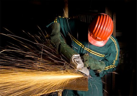 sfregare - heavy industry, manual worker with grinder background Fotografie stock - Microstock e Abbonamento, Codice: 400-04052185