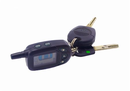 simsearch:400-04590086,k - Black keys from a car with remote control isolated closeup Photographie de stock - Aubaine LD & Abonnement, Code: 400-04052235