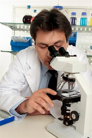 simsearch:400-05670478,k - A scientist observing a substance under the microscope. Stock Photo - Budget Royalty-Free & Subscription, Code: 400-04052446