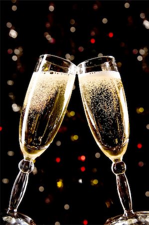 Two champagne glasses making toast over holiday background Stock Photo - Budget Royalty-Free & Subscription, Code: 400-04052519