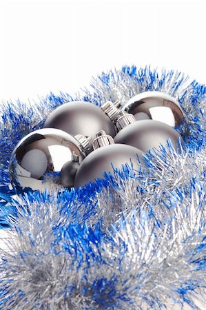 simsearch:400-05177572,k - Several metallic matt and shiny Christmas balls with silver and blue tinsel Stock Photo - Budget Royalty-Free & Subscription, Code: 400-04053199