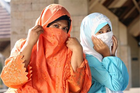 Muslim Females Cowering Faces Stock Photo - Budget Royalty-Free & Subscription, Code: 400-04053930