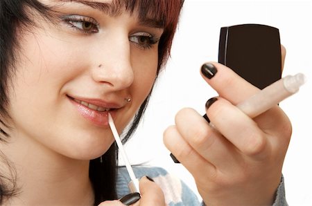 simsearch:400-04172129,k - Woman applying make up Stock Photo - Budget Royalty-Free & Subscription, Code: 400-04053973