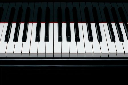 piano à queue - Close-up of a shiny grand piano ebony and ivory keys Photographie de stock - Aubaine LD & Abonnement, Code: 400-04064260