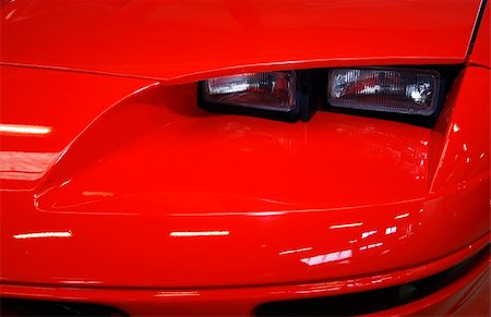 simsearch:400-04950760,k - Fast red sports car close-up with headlights Photographie de stock - Aubaine LD & Abonnement, Code: 400-04064287